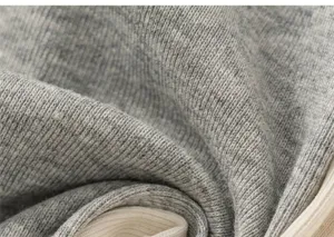 Macro detail of soft grey ribbed knit fabric texture for kids long sleeve t-shirt