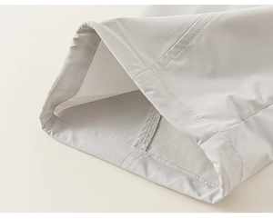 Detail of light grey girls cargo pants featuring high-quality double stitching and tech fabric