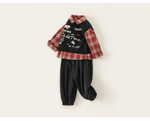 Flat lay of boys' plaid shirt, black graphic knit vest and casual joggers three-piece set