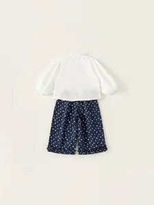 Girls sweet cotton outfit with white ruffle shirt and floral print wide leg trousers