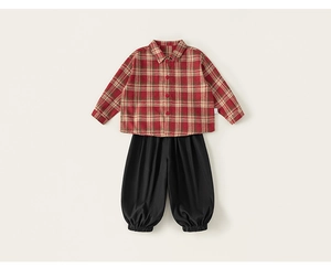 Detail of red plaid flannel shirt with buttons and black elastic jogger pants for kids