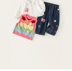Detailed flat lay of toddler 3-piece set featuring rainbow vest and embroidered jeans