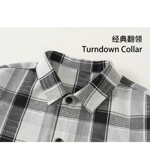 Close-up of classic collar and black buttons on a plaid shirt with woven texture