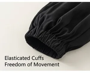 Detail view of black elasticated cuffs on boys casual cotton jogger pants with neat stitching