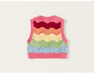 Detailed top view of child's colorful wavy striped knitted vest with pink ribbed edges