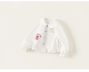 Close-up of girls shirt featuring Peter Pan collar, colorful buttons, and cat print