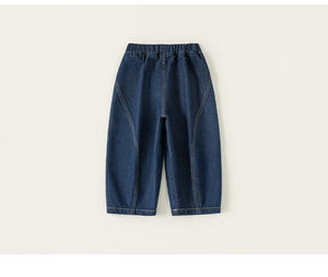Detail of kids dark blue denim jeans featuring elastic waist and yellow contrast stitching