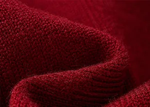 Macro shot showing soft burgundy knit texture and high-quality material of the boy's vest