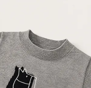 Close-up of the classic ribbed crew neck and fine knitting texture on a grey kids' vest