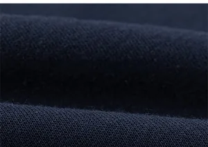 Close-up of premium navy blue knit fabric texture for kids sweatshirt