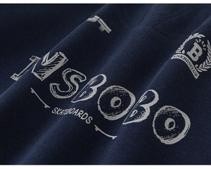 Detail of vintage SBOBO skateboard print on navy blue sweatshirt with distressed texture
