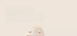 Close-up of quilted floral hooded jacket for girls with cute 3D ears on the hood
