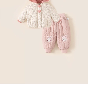 Detail of toddler floral quilted hooded jacket and pink pants with bunny embroidery