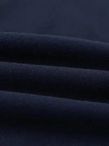 Macro view of navy blue high-quality knitted fabric with soft wave texture for kid sweatshirts