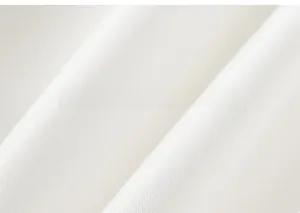 Close-up of premium white cotton knit fabric texture for girls' asymmetrical tutu skirts