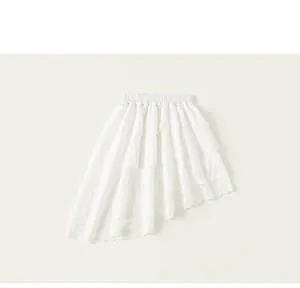 Detail of white tiered irregular skirt with floral lace trim and elastic waist