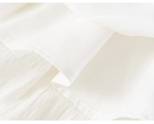 Detailed close-up showing layered white mesh fabric and smooth lining of the skirt
