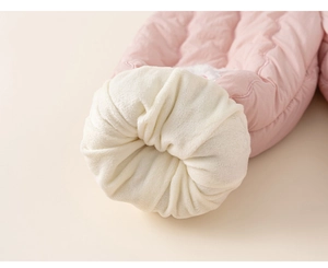 Detail of light pink quilted fabric and warm white faux fur lining for kids' winter sets