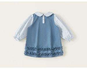 Detail of baby girl denim dress with striped peter pan collar and elastic cuffs