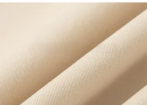 Detailed macro view of the premium apricot twill fabric texture for children's hoodies