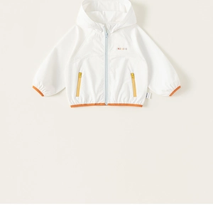 Close-up of lightweight kids windbreaker with blue zipper and orange hem detailing