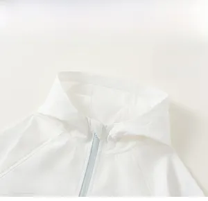Close-up of children's white sun protection hoodie with blue zipper and smooth texture