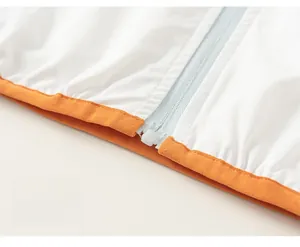 Detail of color-block hem and resin zipper on children's breathable sun protection jacket