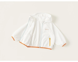 Detail of children's white hooded windbreaker with orange zippers and elastic cuffs