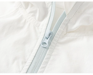 Detail of white hooded sun protection jacket featuring light blue zipper and textured fabric