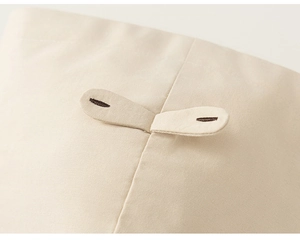 Detailed macro view of high-quality cotton fabric stitching and brown embroidered buttonholes