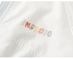 Detailed macro view of INSBONO rainbow embroidery and fabric texture on kids' white hoodie