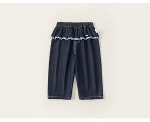 Detail of dark blue denim pants for girls with elastic waist and plaid ruffled trim