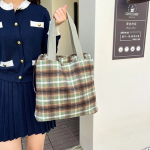 Winter plaid wool tote bag with green shoulder strap in casual collegiate style