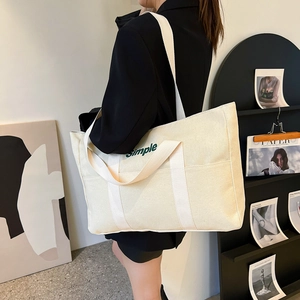 Minimalistische cremefarbene Canvas-Einkaufstasche mit Simple-Print und Doppelgriff