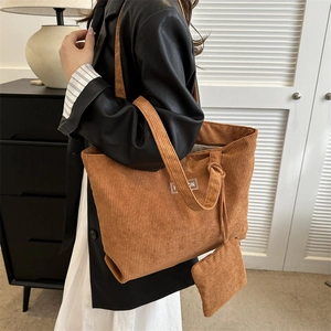 Caramel brown corduroy tote bag with mini pouch featuring a stylish fashion label