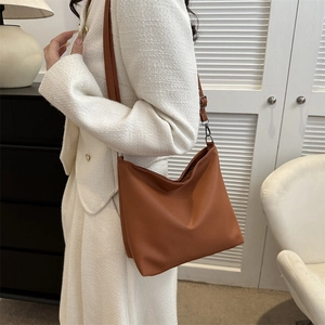 Brown PU hobo shoulder bag with litchi texture and dark gunmetal hardware detail