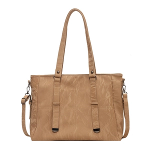 Minimalist camel PU leather tote bag with pleated texture and adjustable shoulder strap