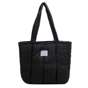 Minimalist black quilted down tote bag with a sleek finish and spacious interior for daily use