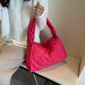 Quilted fuchsia puffer tote bag in shiny nylon fabric with wide padded shoulder strap