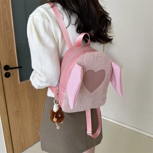 Pink plush rabbit ear backpack with heart patch and pompom pendant for women