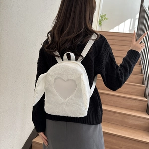 Minimalist white plush backpack for women featuring cute rabbit ears and heart patch detail