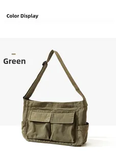 Detail view of military green canvas messenger bag with adjustable strap and pockets