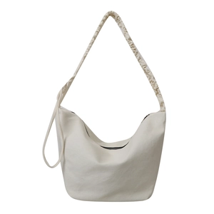 Sac à bandoulière en toile beige minimaliste avec bandoulière plissée et zip