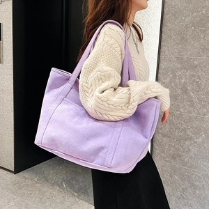 Minimalist lavender purple tote bag made of high-quality canvas worn by a model