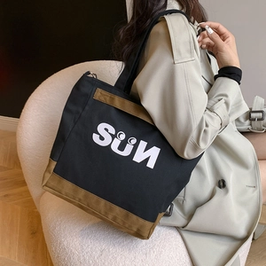 Minimalist canvas tote bag with SUN print in black and brown contrast for women