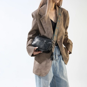 Chic black PU leather crossbody camera bag with vintage quilting and bohemian strap