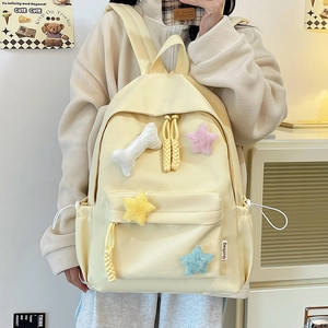 Sac à dos minimaliste en nylon jaune crème avec étoiles en peluche et tirette de zip tissée