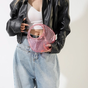 Detail of pink translucent acrylic handbag featuring modern 3D bubble textured surface