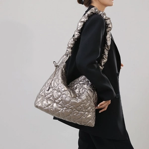 Metallic silver quilted nylon shoulder bag with ruffled strap and stylish puffed texture