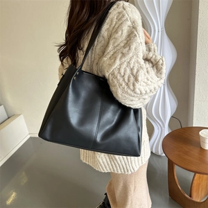 Minimalist black PU leather tote bag with large capacity for daily commuting wear